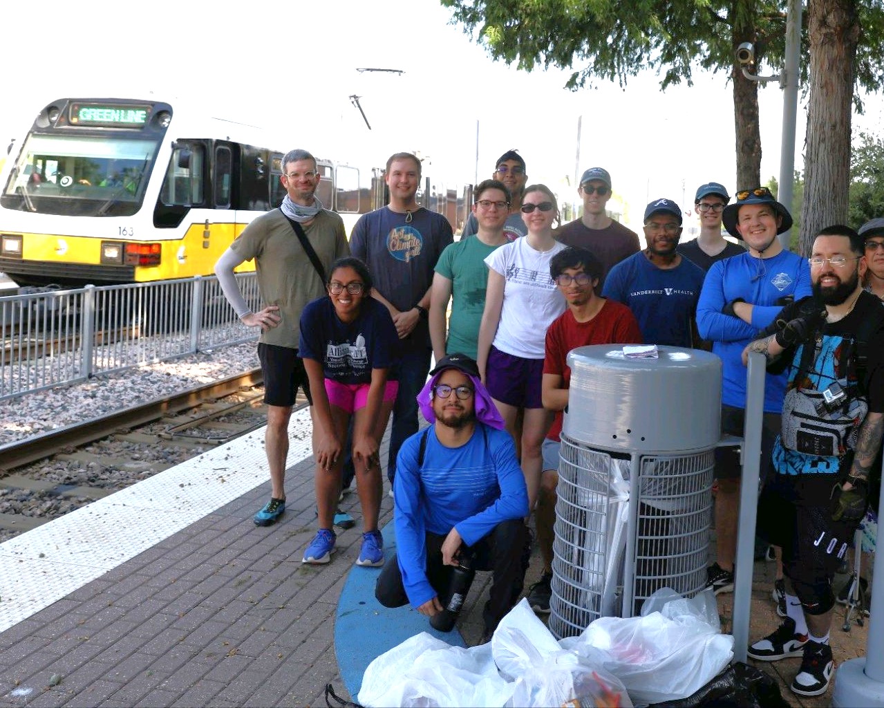 Trash pickup event at Farmers Branch Station by Dallas Area Transit Alliance / DATA
